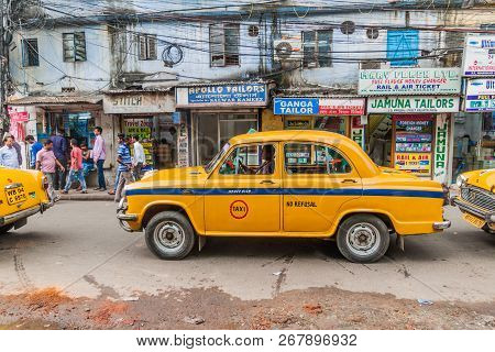 Kolkata, India - October 27, 2016: View Of Yellow Hindustan Ambassador Taxi In The Center Of Kolkata