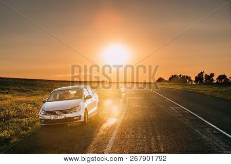 Gomel, Belarus - August 25, 2016: Sun Rising Over Vw Volkswagen Polo Vento Sedan Car Parking Near As