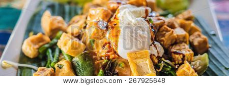 Gado-gado Indonesian Salad Served With Peanut Sauce. Ingredients: Tofu, Spinach, String Beans, Soy S