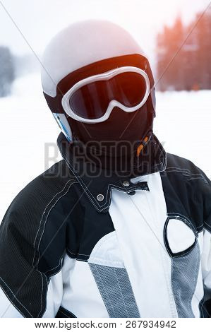 Portrait Of Teenager Skier On Snowy Mountain.