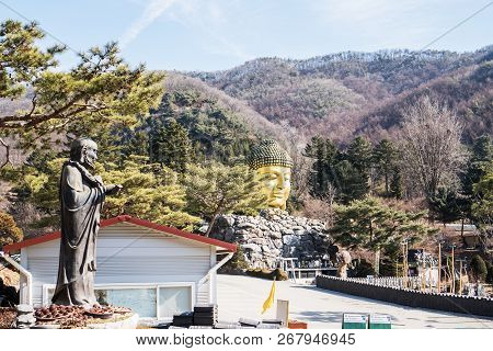 Yongin, Korea - February 15,2018: Golden Head Big Buddha Statue At Yunwha Mountain, Wawoo Jeongsa Te