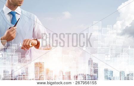 Double Exposure Of Confident And Young Businessman In Smart-casual Wear Smoking Pipe And Modern City