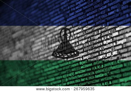 Lesotho Flag  Is Depicted On The Screen With The Program Code. The Concept Of Modern Technology And 