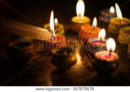Earthen Diya Lamp Lighting With Candles On The Occasion Of Diwali And Sandhi Pujo