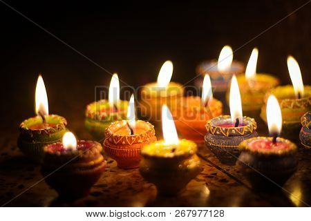 Earthen Diya Lamp Lighting With Candles On The Occasion Of Diwali And Sandhi Pujo