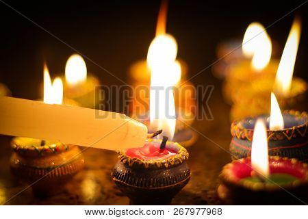 Earthen Diya Lamp Lighting With Candles On The Occasion Of Diwali And Sandhi Pujo