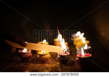Earthen Diya Lamp Lighting With Candles On The Occasion Of Diwali And Sandhi Pujo