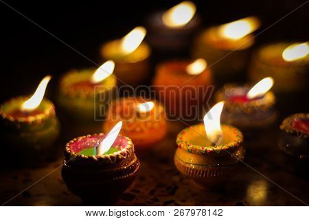 Earthen Diya Lamp Lighting With Candles On The Occasion Of Diwali And Sandhi Pujo