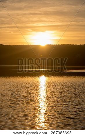 Sunset In The Ruidera Lagoons With The Golden Sky