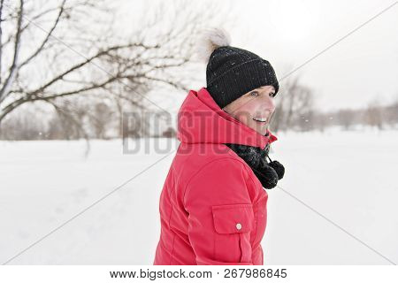 Nice Woman In Winter Outdoors Having Fun