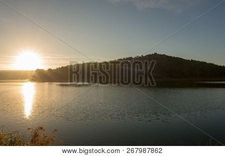 Sunset In The Ruidera Lagoons With The Golden Sky