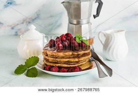 Gluten-free Green Buckwheat Pancakes With Fresh Berries And Maple Syrup. Delicious Vegan Breakfast W