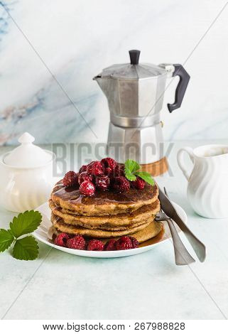 Gluten-free Green Buckwheat Pancakes With Fresh Berries And Maple Syrup. Delicious Vegan Breakfast W