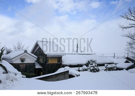 Exterior Of Long Wooden House Under Heavy Winter Snow In Shiga, Japan