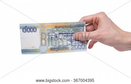 Female Hand Holding A 2000 Kip Banknote Currency Isolated On A White Background. Denomination Of 200