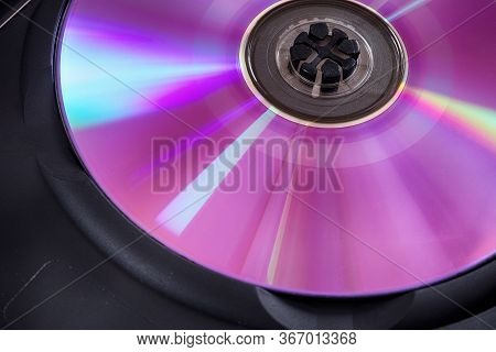 Back Side Of A Dvd Disс With Some Dust. Low Key. Close Up.