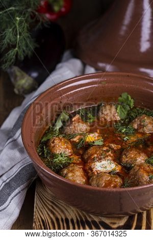 Moroccan Tagine Of Lamb With Kefta Meatballs In Tomato Sauce