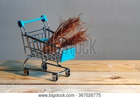 Shiny Copper Wire In A Supermarket Trolley. Non-ferrous Metal Purchase