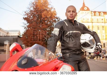 African Man On A Sport Motorbike In The City