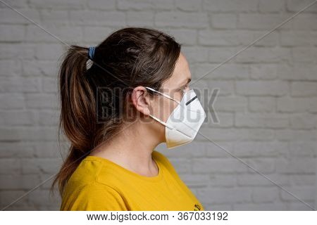 Young Woman Wearing Kn-95 Protection Medical Mask. Prevention Of The Spread Of Virus And Epidemic, P