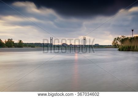 Cable-stayed Bridge Over A Dutch River Near The Town Of Kampen
Overijssel With A Cloudy Sunset