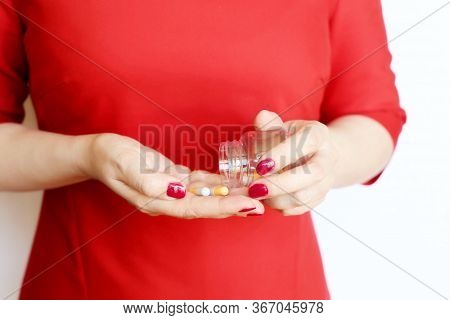 Pills In Female Hands, Woman In Red Dress Holding Bottle Of Medical Capsules. Concept Of Vitamins Fo