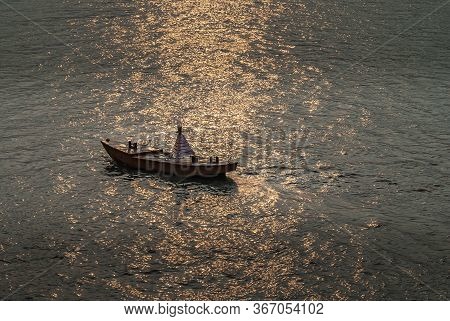 Chongqing, China - May 8, 2010: Evening Light On Yangtze River. Closeup Of Reflected Sunlight On Bro