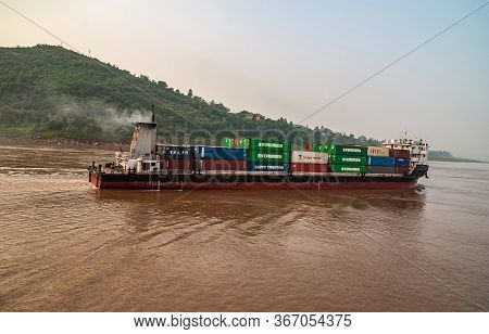 Chongqing, China - May 8, 2010: Evening Light On Yangtze River. Container Ship Sails On During Twili