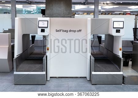 Luggage Drop Off Service In Airport Terminal. Self Bag Drop Kiosks.