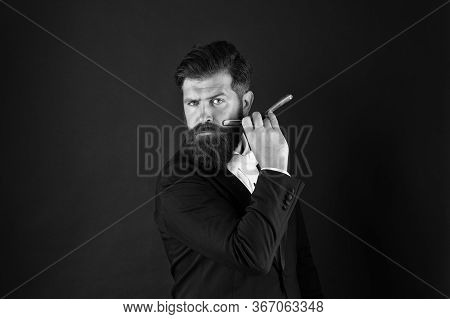 Barbershop For Gentlemen Only. Businessman Hold Barbers Tool Dark Background. Bearded Man Shave In B