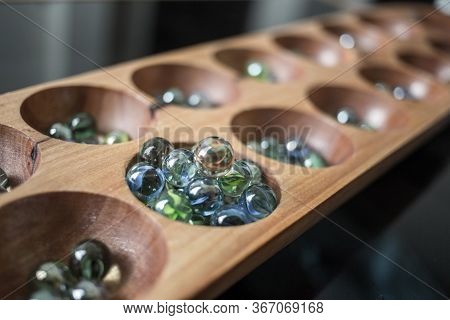 Hand Hold Glass Ball In Kalaha Game
