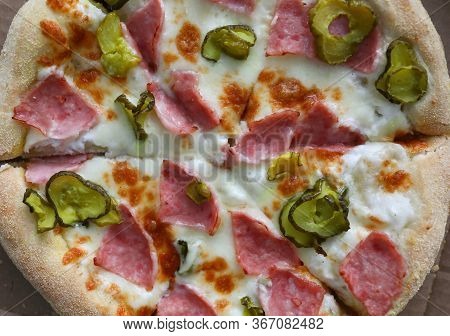 Top View Of Delicious Pizza. Traditional Italian Meal. Round Shaped Snack With Salami Double Cheese 
