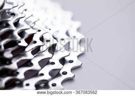 Close-up Of Bicycle Roller Chain That Transfers Power From Pedals To Drive. Macro Shot Of Metal Whee