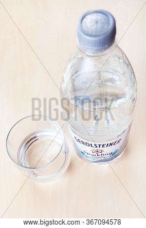 Moscow, Russia - May 10, 2020: Plastic Bottle Of Gerolsteiner Sprudel Sparkling Water And Glass On B