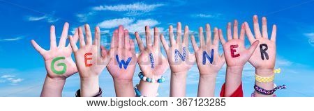 Children Hands Building Word Gewinner Means Winner, Blue Sky