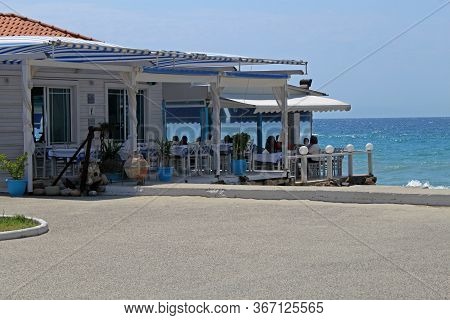 Traditional Greek Tavern On The Coast Of Aegean Sea