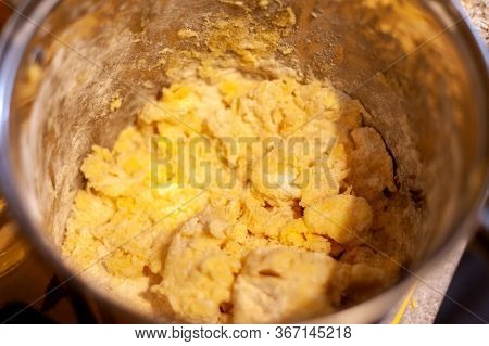 Raw Yellow Dough In A Kitchen Bowl, Cooking Pot Closeup. Making A Cake, Baking At Home, Authentic Tr