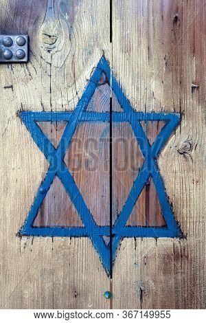 Jewish Symbol, A Blue Star Of David Hand Painted On Wood, Wooden Door. Judaism Star On Planks, Judai