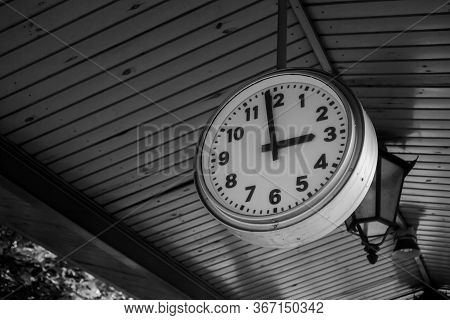 Black And White Train Station Clock Showing One Minute Before 3:00, 3 Pm - Three Pm, Three O'clock. 