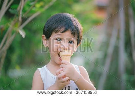 Asia Boy He Mouth Aftertaste From Eating Chocolate Ice Cream  Or Chocolate Dessert. A Sweet-toothed 