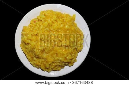 Khichdi Dish With Chilli In A Plate Isolated On Black Background, Also Known As Khichuri Or Khichri