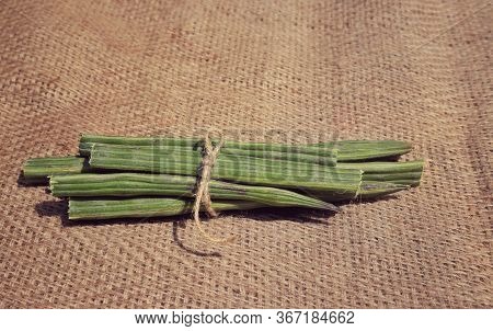 Drumstick Pods Or Moringa Oleifera Pods On Burlap Background