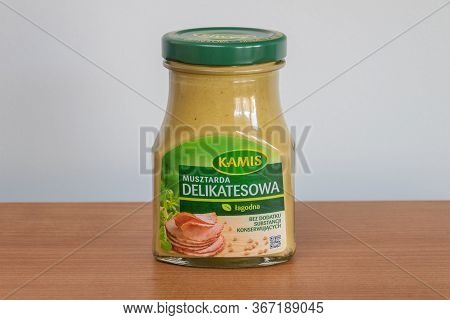 Pruszcz Gdanski, Poland - May 17, 2020: Kamis Delikatesowa Mustard In A Glass Jar On Wooden Table.