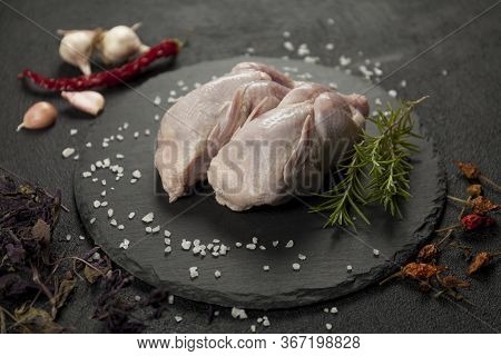 Raw Partridge Meat On Kitchen, Cooking Gourmet Wild Bird. Healthy Diet Recipe.