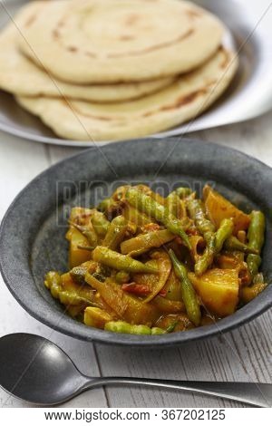Sengri aloo ki sabzi, simmered radish pods & potatoes with spices, indian cuisine