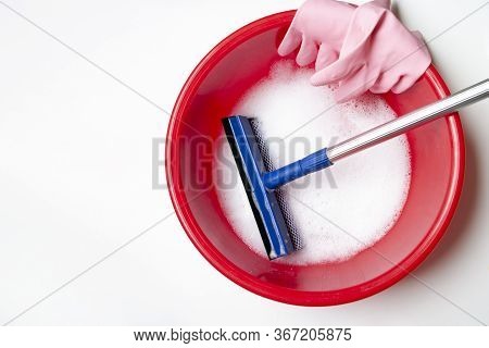 Tools For Cleaning Windows At Home, Rubber Gloves, Washbowl, Soap Foam, Squilgee.