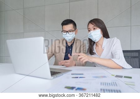 Business Employees Wearing Mask During Work In Office To Keep Hygiene Follow Company Policy.preventi