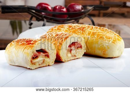 Brazilian snack, wrapped in ham and mozzarella
