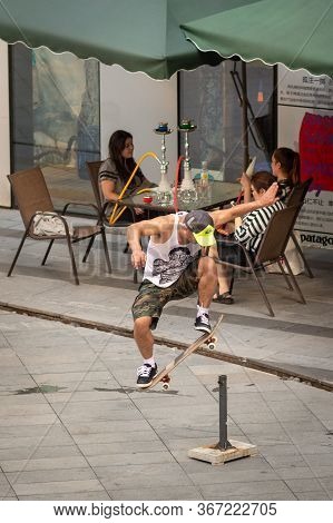 Skater With A Skateboard In Modern Sanlitun Area Of Beijing, China