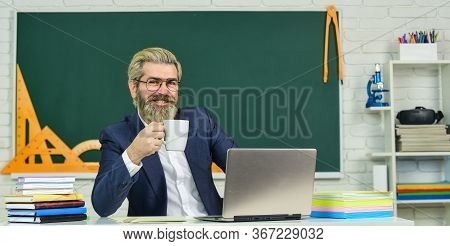 Want A Cup. Bearded Man Relax Drinking Coffee In Class. Thirsty Teacher. Drinking Tea Habit. Drinkin